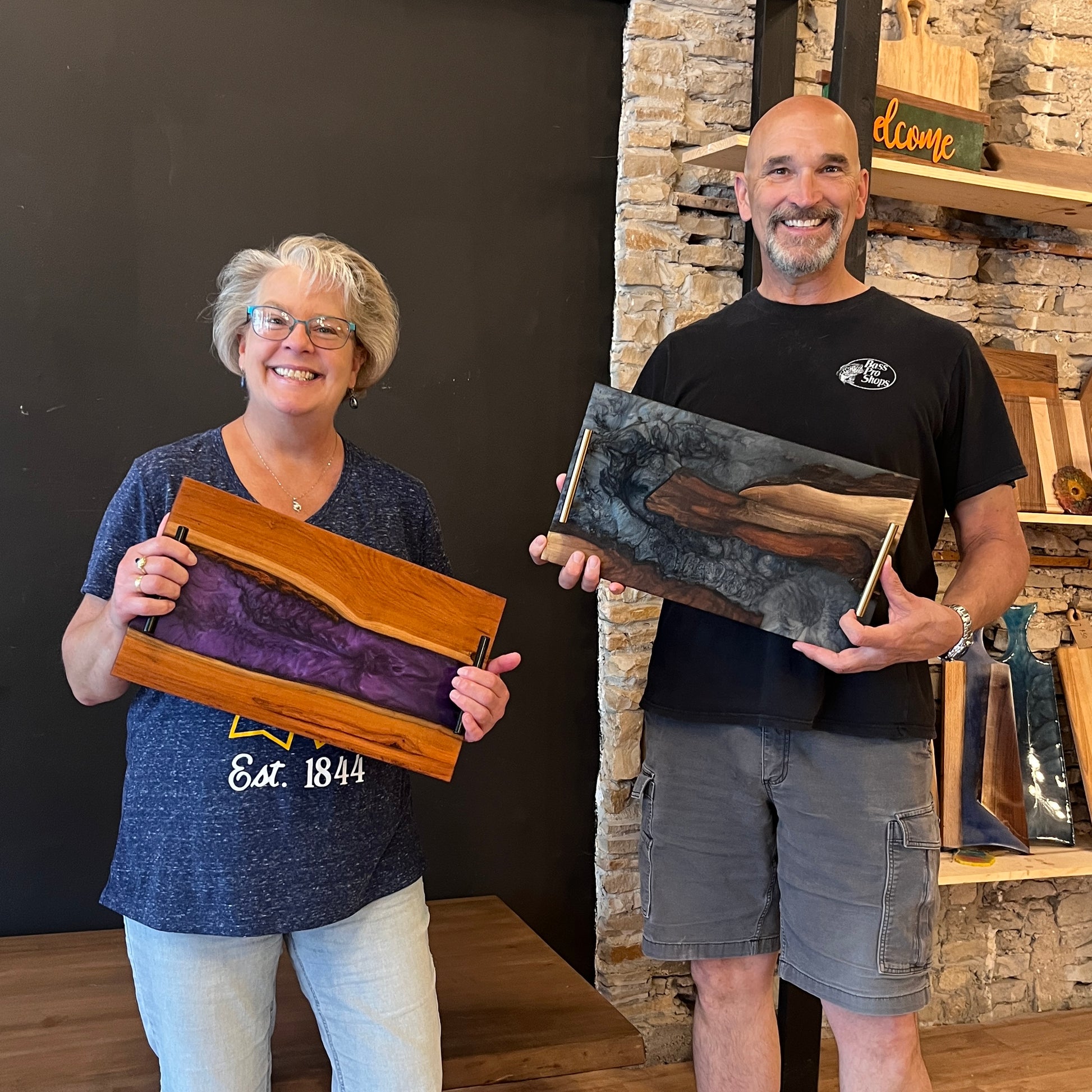 smiling people with epoxy serving trays